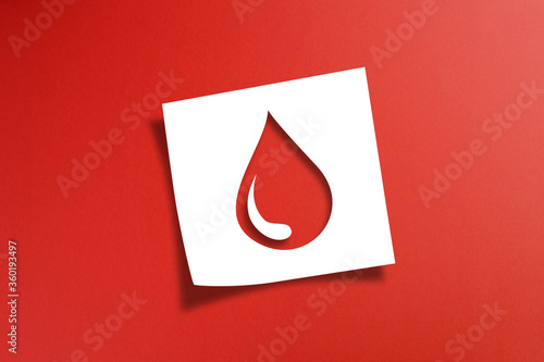 Bild auf Leinwand Note paper with blood donation concept on red background