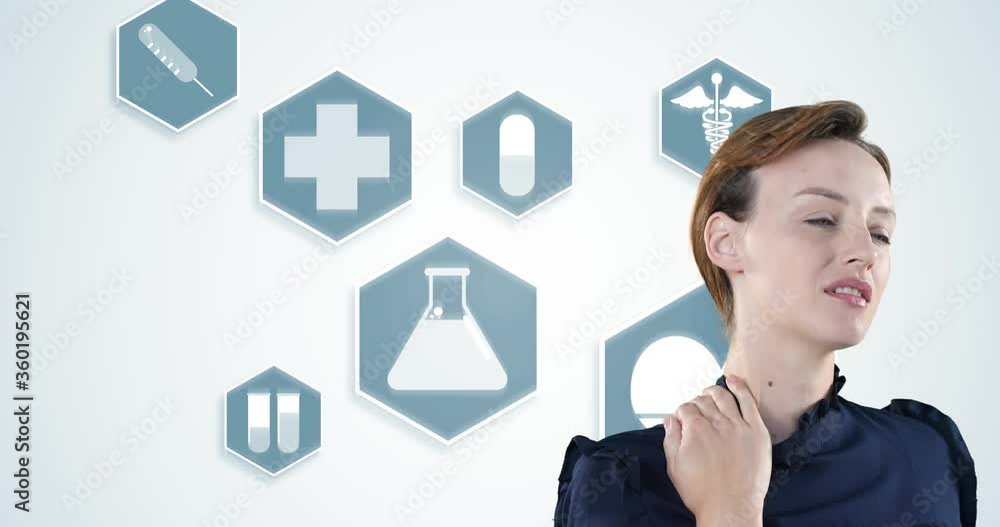 Attractive Caucasian woman touching her shoulders while suffering from back pain with blue icons Attractive Caucasian woman touching her shoulders while suffering from back pain with blue icons