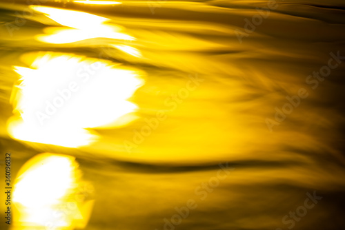 Abstract image of sunlight in the evening relfecting in rippled water photo