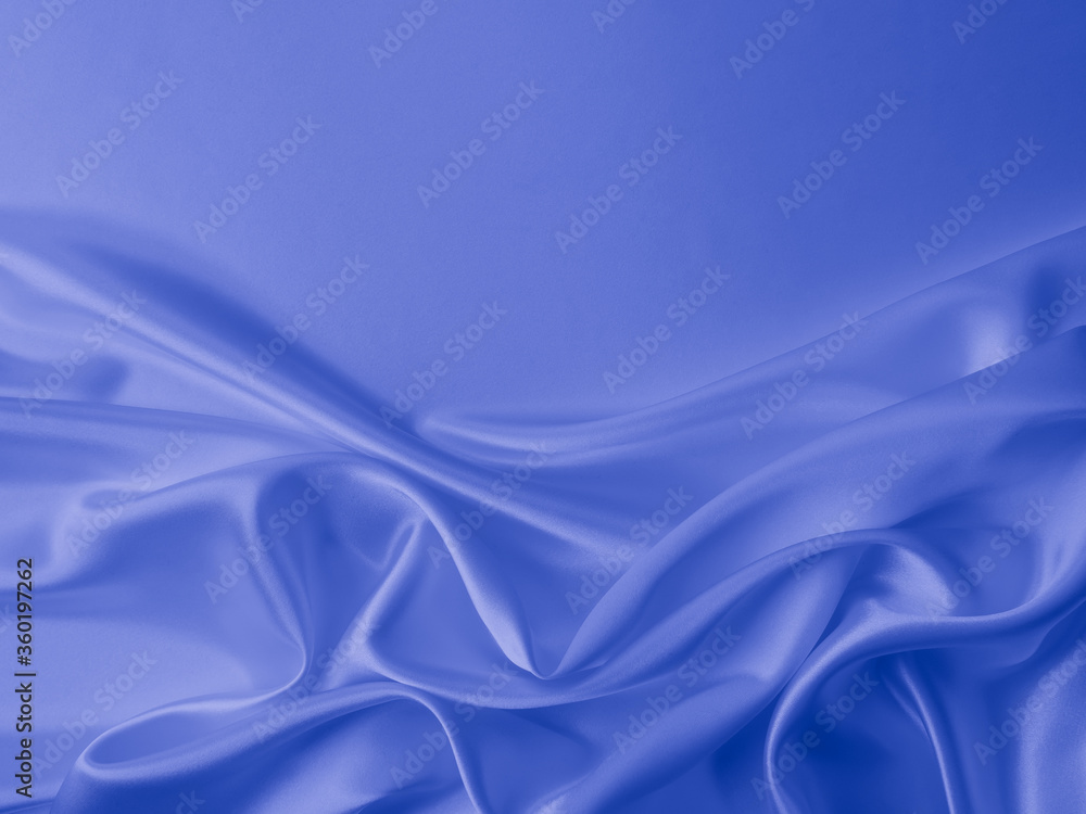 Smooth elegant wavy blue satin silk luxury cloth fabric texture