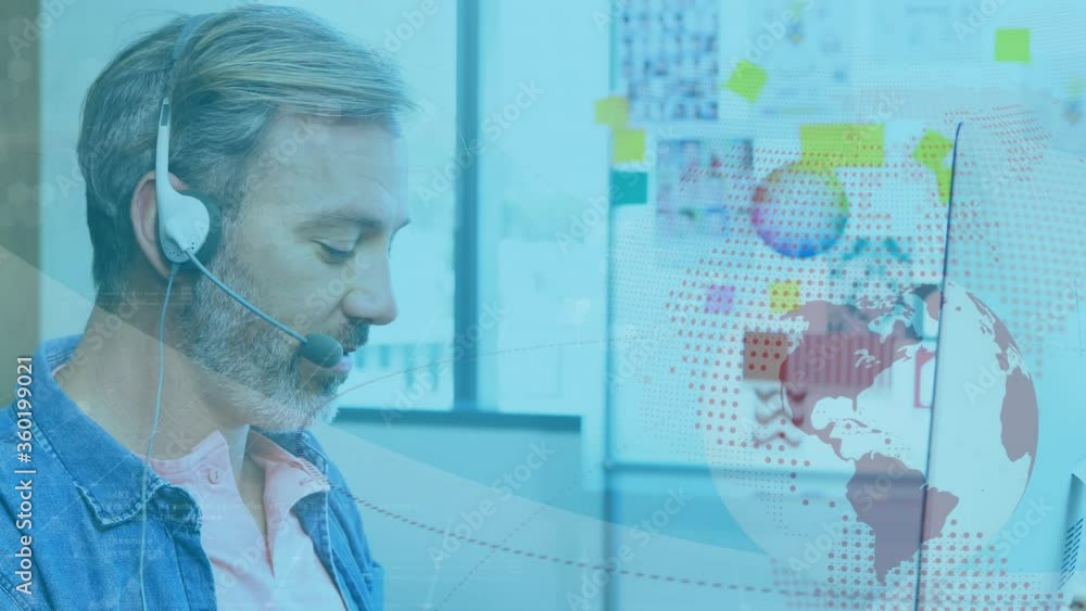 Animation of Caucasian man wearing a headset using a computer over globe spinning Animation of Caucasian man wearing a headset using a computer over globe spinning