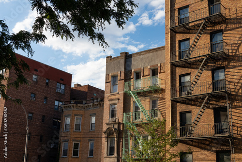 Old Brick Residential Buildings with Fire Escapes in Astoria Queens New York