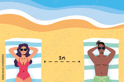 interracial couple on the beach practicing social distancing scene ,summer time vacations