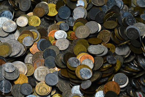 Many metal coins on the table