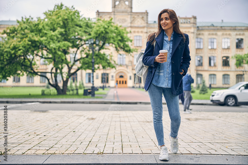 Beautiful lady in casual clothes near university