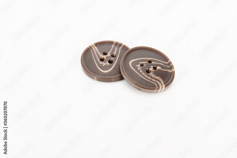 Two stone textured dress buttons. Two stone textured dress buttons.