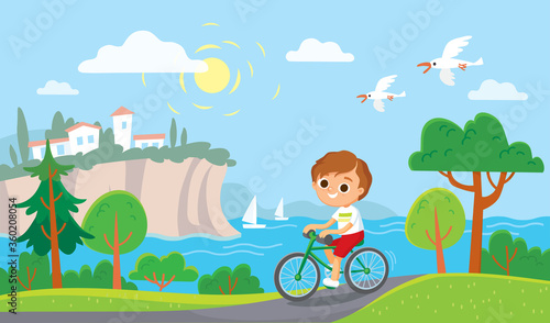 Boy riding a bicycle. Summer mediterranean background.