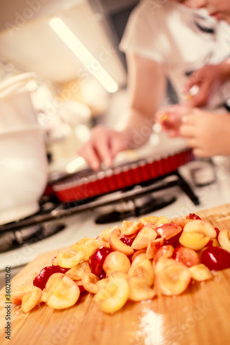 cooking and baking cherry pie with almond slices