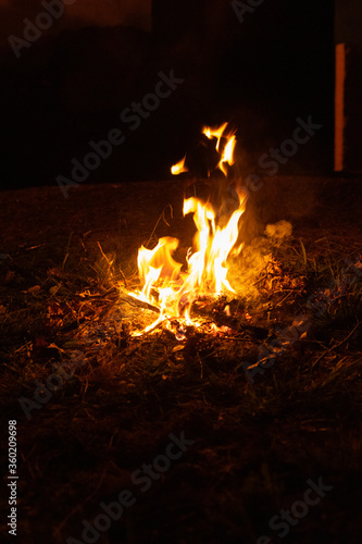 Small campfire in the middle of the field