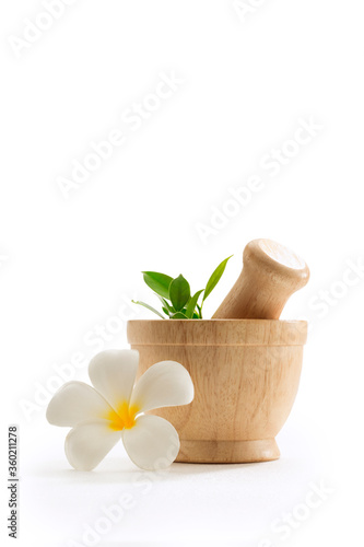 close up view of wooden herbal mortar on white back. Banner.