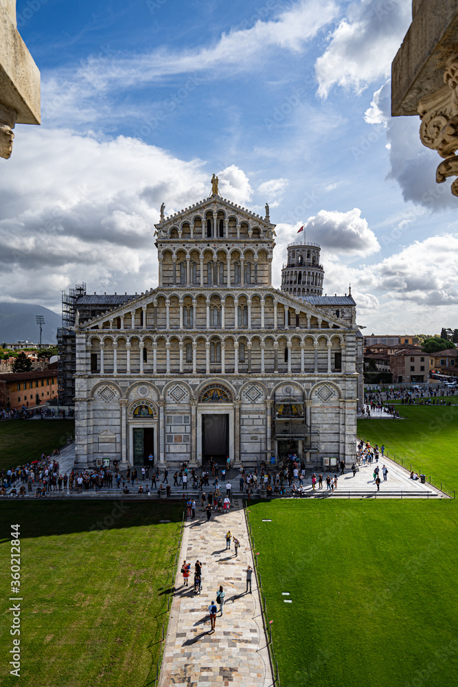 Duomo Leaning tower of Pisa with dramatic blue cloudy sky
