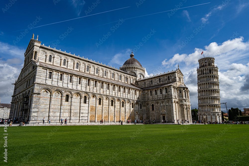 Duomo Leaning tower of Pisa with dramatic blue cloudy sky