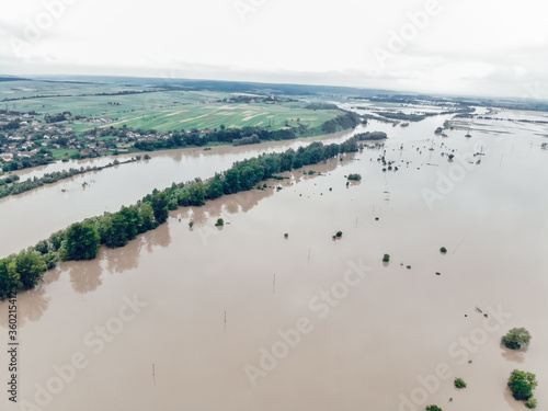 Flood on the Dniester River. Flooded village of Galich. Fields in dirty water. Natural disasters  rains and floods