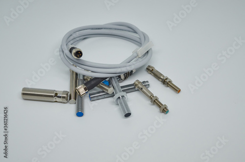 Many Inductive proximity sensor or proximity switch on a white background.