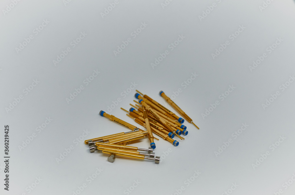 Potentiometers stand on the gray background. Many Potentiometers. Macro close up of electronic component potentiometer Potentiometers stand on the gray background. Many Potentiometers. Macro close up of electronic component potentiometer