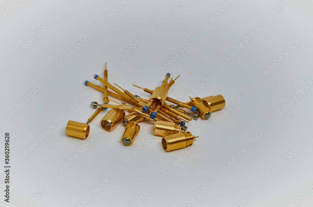 Potentiometers stand on the gray background. Many Potentiometers. Macro close up of electronic component potentiometer Potentiometers stand on the gray background. Many Potentiometers. Macro close up of electronic component potentiometer