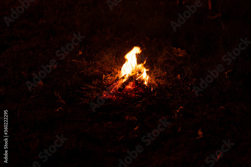 Small campfire on the middle of the field