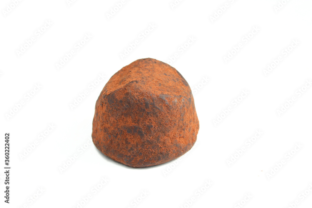 Belgian chocolate truffle isolated on white background. Cocoa dusted dessert Belgian chocolate truffle isolated on white background. Cocoa dusted dessert
