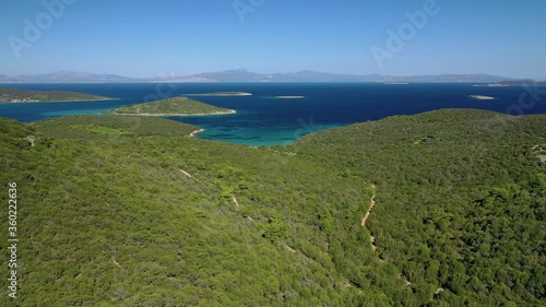 Aerial drone video of beautiful paradise island complex in gulf of Petalion that form a blue lagoon in South Evia island near Marmari, Greece photo