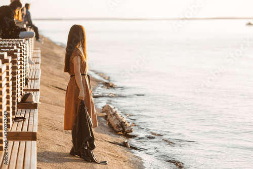 girl's walk along the river Bank