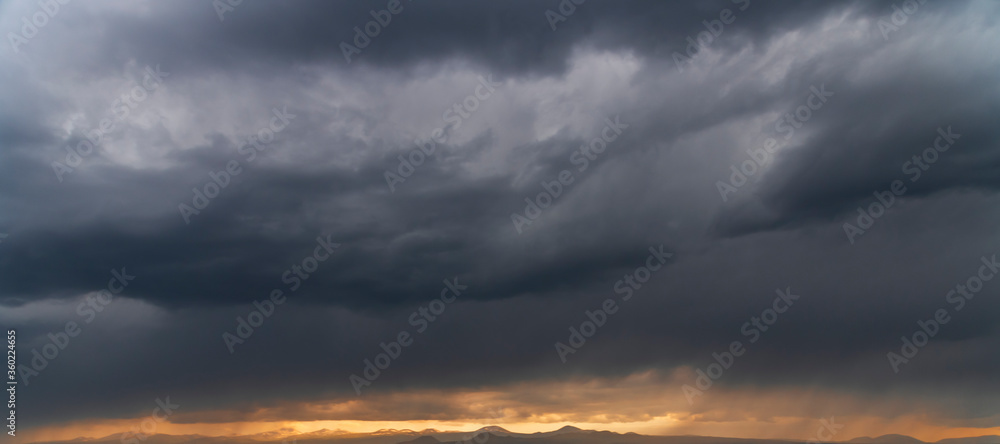 Beautiful landscape. Dramatic storm clouds over the mountains after rain.