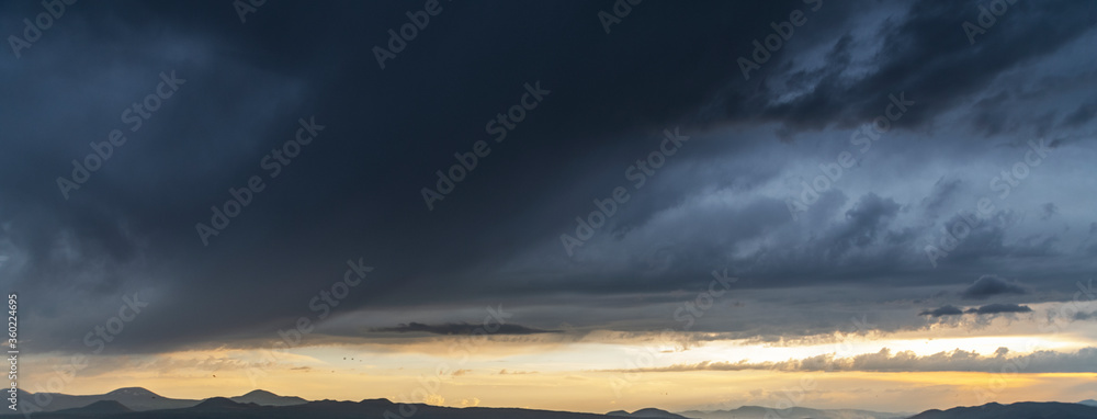 Fototapeta premium Beautiful landscape. Dramatic storm clouds over the mountains after rain.