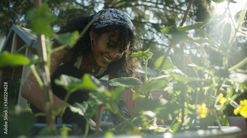 Young urban woman working in the garden