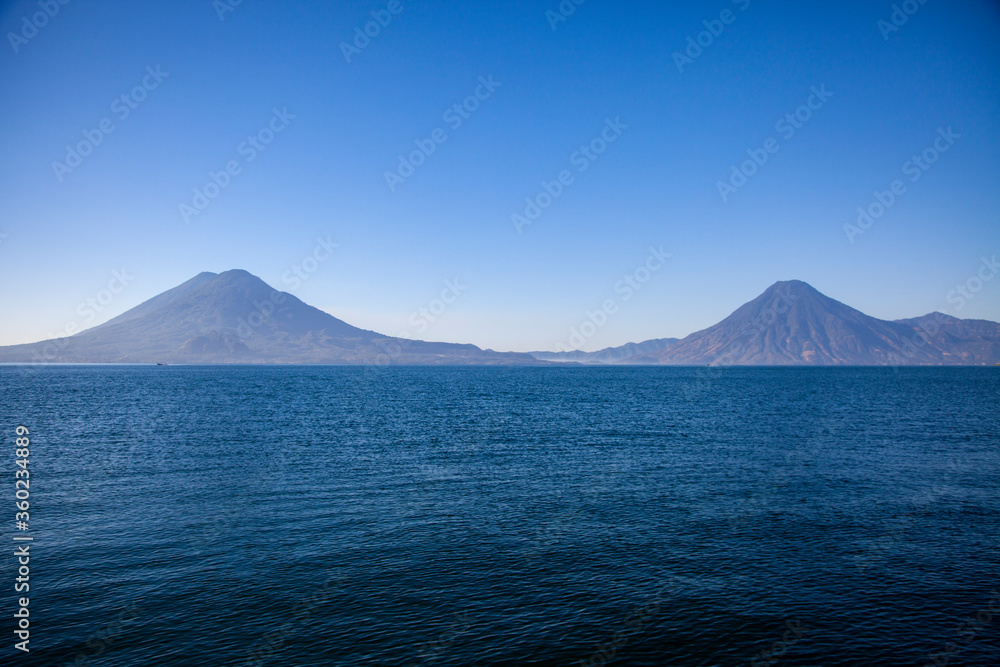 Lake Atitlan is a beautiful lake in the mountains of Guatemala and is surrounded by active volcanos.