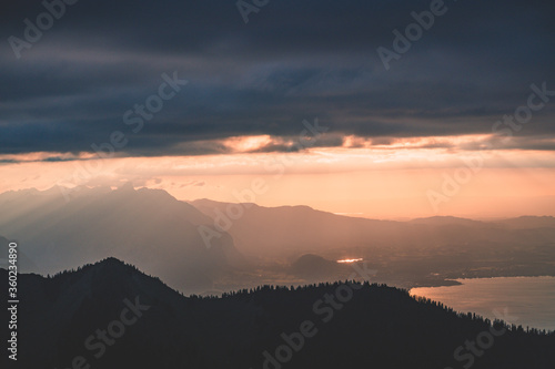 Sunbeams seeking through the clouds just before sunset, Switzerland, Interlaken