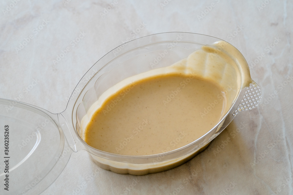 Tahini Hummus Sauce for Falafel Balls in Plastic Cup Ready to Use and Eat. Tahini Hummus Sauce for Falafel Balls in Plastic Cup Ready to Use and Eat.