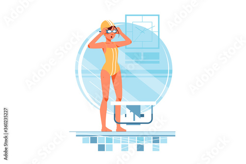Happy woman coaches and swimmers adjusts swimming goggles for training.