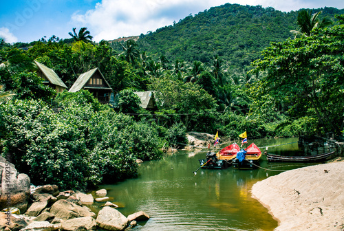 Two boats in the tropical jungle on Koh Phangan island in Thailand