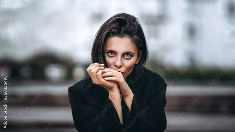 Close up portrait of young woman with short haircut and red lips outdoors Close up portrait of young woman with short haircut and red lips outdoors