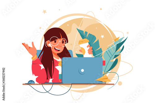 Happy woman with glasses using laptop for distance communication.