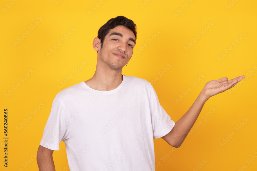 young teenager man pointing isolated on color background with white t-shirt young teenager man pointing isolated on color background with white t-shirt