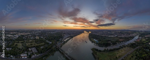 Panoramic aerial picture of Mainspitze area with Main river mouth and city of Mainz during sunset