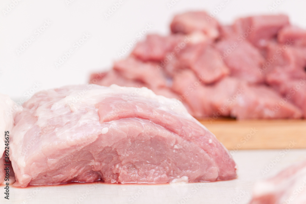 Raw pork belly pieces on a cutting board. Preparing, cooking. Raw pork belly pieces on a cutting board. Preparing, cooking.