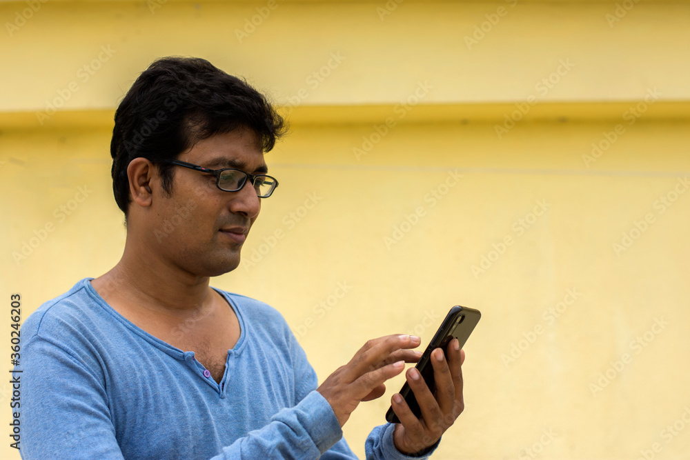 Indian male model watching mobile Indian male model watching mobile