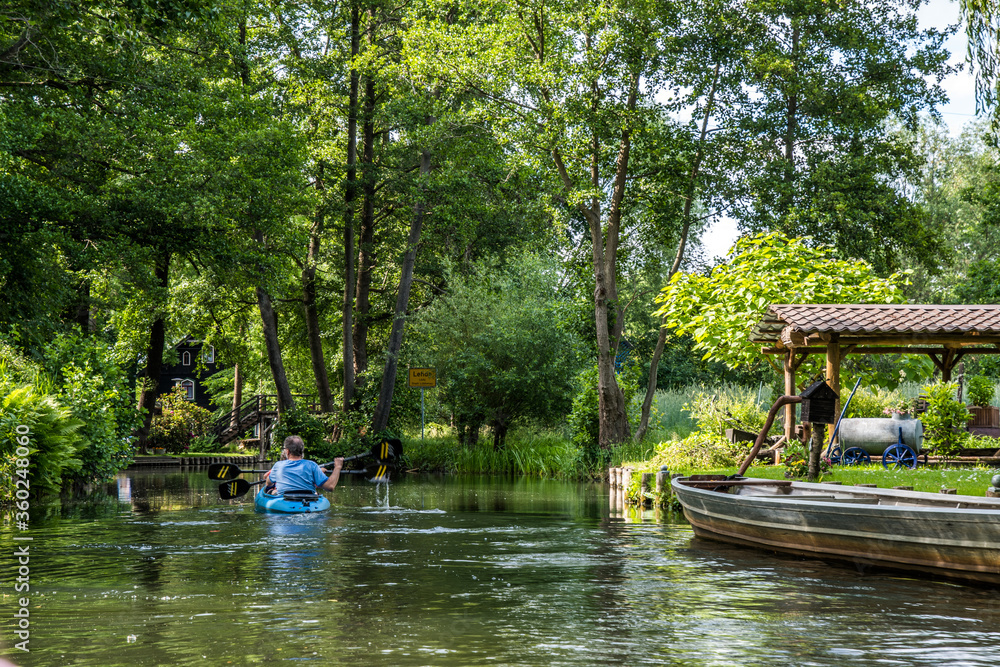 Boats on the water canal in biosphere reserve Spree forest (Spreewald) in the state of Brandenburg, Germany