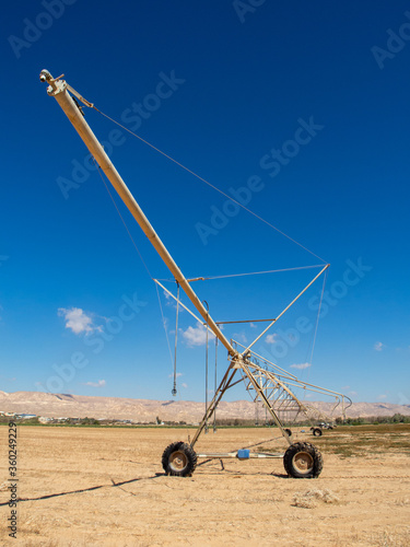 Center-pivot irrigation also called water-wheel and circle irrigation, is a method of crop irrigation in which equipment rotates around a pivot and crops are watered with sprinklers.