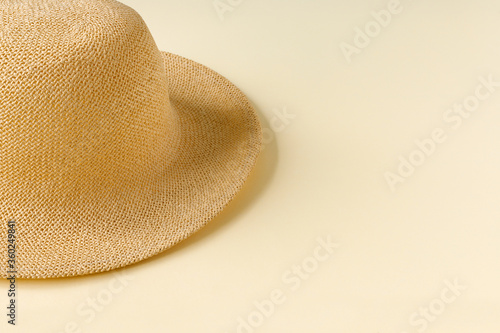  Beautiful straw hat  on the ocean coast . Nature summer background.