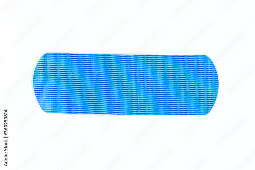 Obraz premium One blue wound patches detectable in a metal detector, isolated on a white background with a clipping path.