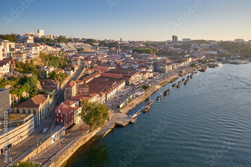 Portugal. The city of Porto. The evening sun. Quarter and portwine delivery fleet. View from the upper tier of the Louis I bridge