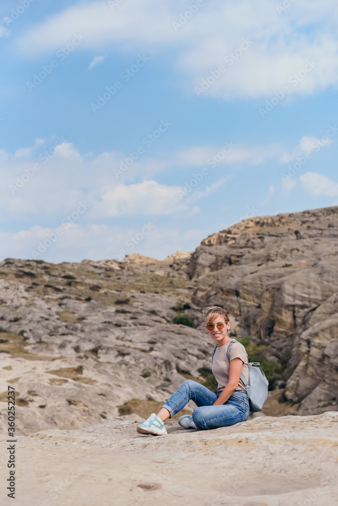 Young beautiful women on a camping trip, 
 young woman hiking, woman hiking on a background of mountains