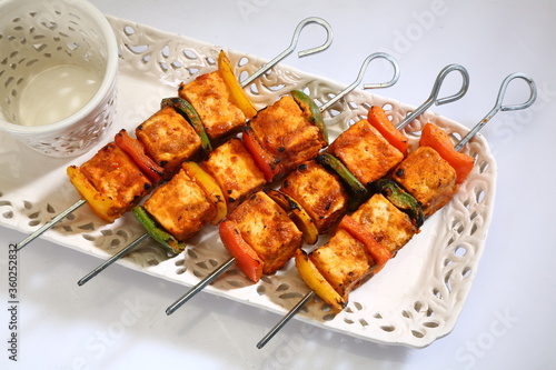 Tandoori Paneer Tikka or Marinated Cheese cubes with spices and yogurt, Indian Dish