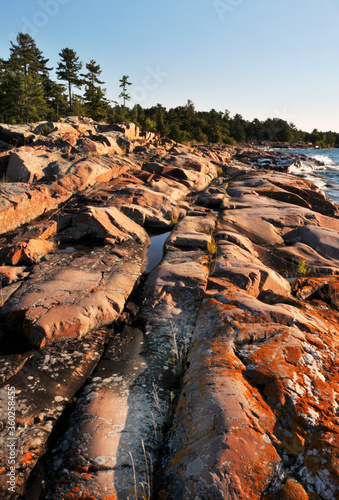 Smooth rocks and waves of shoreline of Georgian Bay Ontario Canada