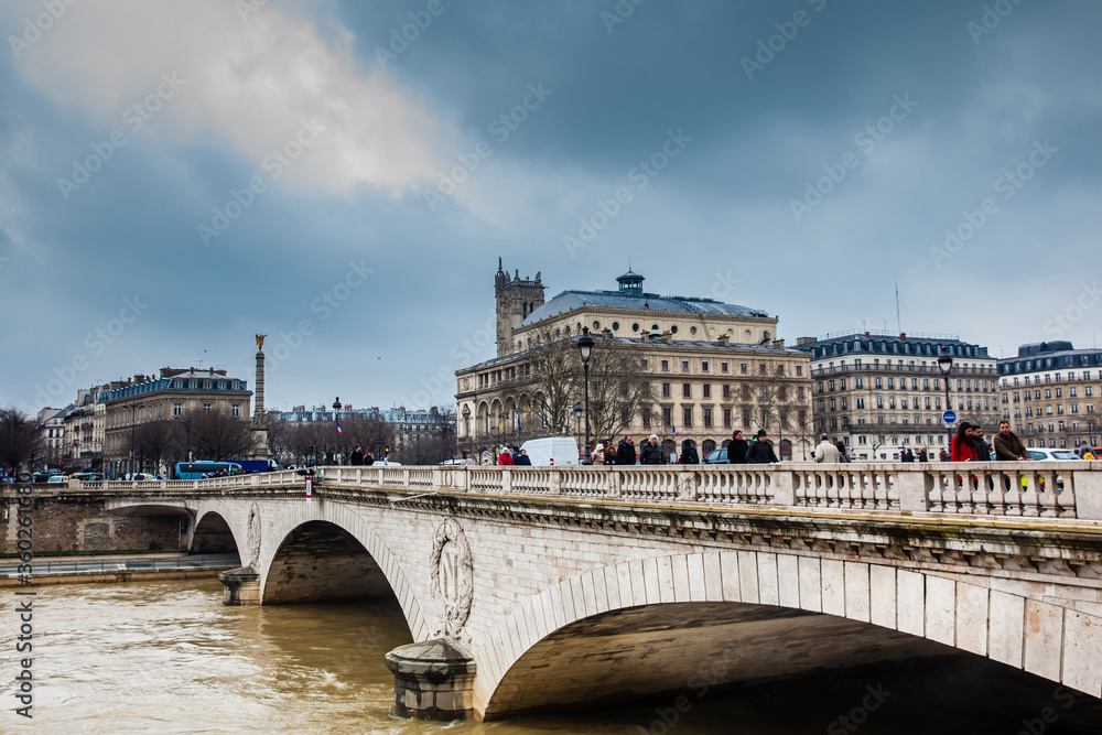 Pont au Change over the Seine river in a cold winter day in Paris