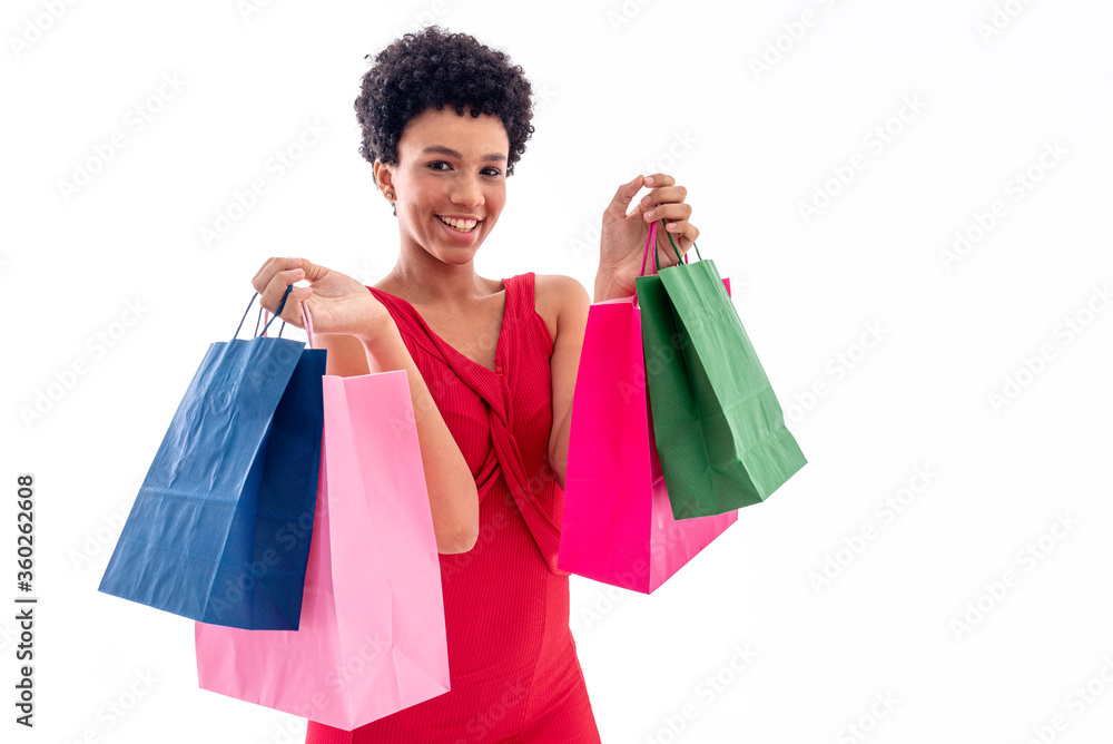 Elegant young woman smiling with shopping bags in hands. Beautiful portrait of female model with shopping bags in hands on white background.
Elegant young woman smiling with shopping bags in hands. Beautiful portrait of female model with shopping bags in hands on white background.