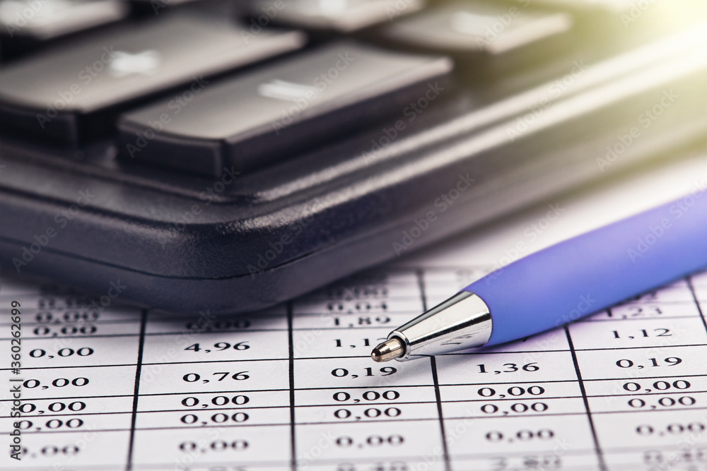 accounting document with pen and calculator. Concept of banking, financial report and financial audit. accounting document with pen and calculator. Concept of banking, financial report and financial audit.