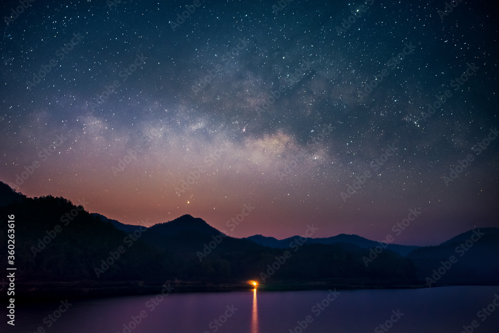Beautiful landscape mountains and lake in the night with Milky Way background, Chiang mai , Thailand